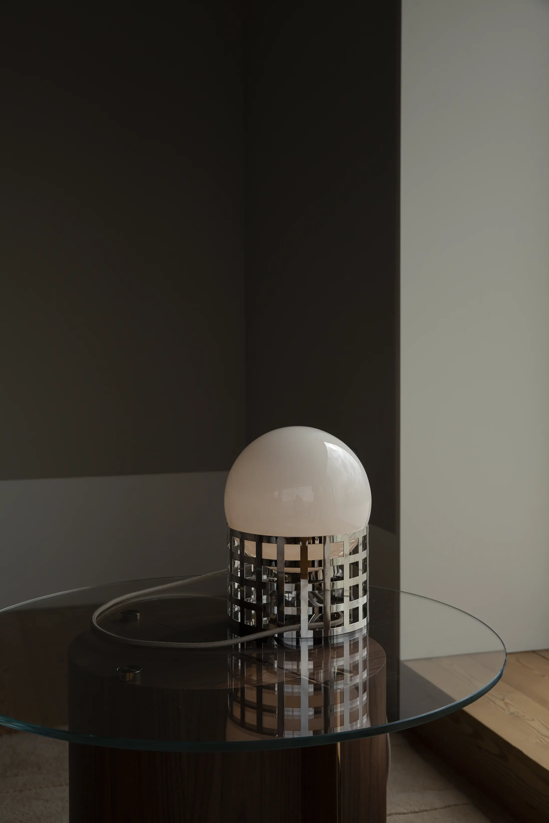 Full Moon Ride Table Lamp - Inspired by the iconic chrome finishes of the Mid Century era. Features a meticulously crafted grid pattern accentuating its geometric harmony. Conceptually alluring and transcending boundaries of conventional lighting.